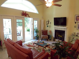 French doors open to the lanai & pool
